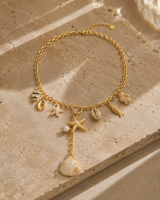 Collier charms marin doré en acier inoxydable – coquillage, étoile de mer, poisson nacré et pendentif coquille – Bijoux Incandescence